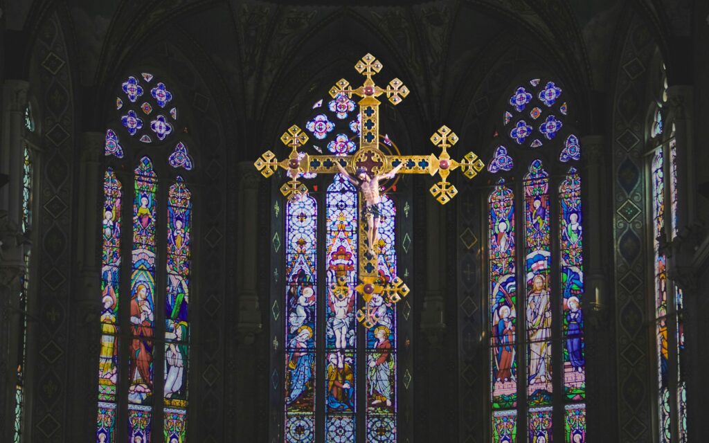 Stained glass and gold cross